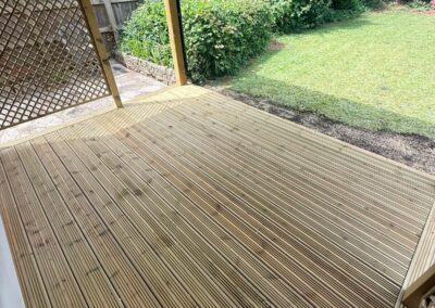 Wooden decking inside of a garden pergola